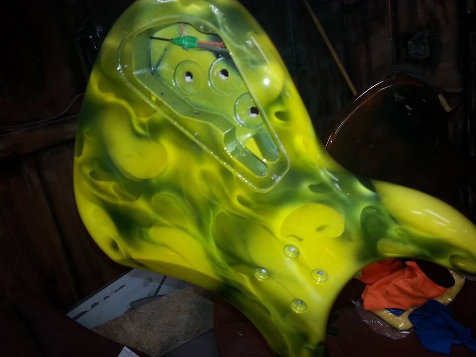 This guitar is painted with yellow and black candy concentrates.