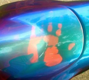 John Haro's handprint on his thermochromic pigment painted motorcycle tank. Temperature changing chameleon!.