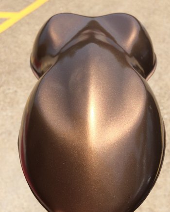 Nut Brown candy paint pearls sprayed on a speed shape, or car shape test panel.