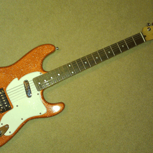 This is a Custom Paint Job using our metal flake guitar paint additive, Orange Copper Metal Flake.